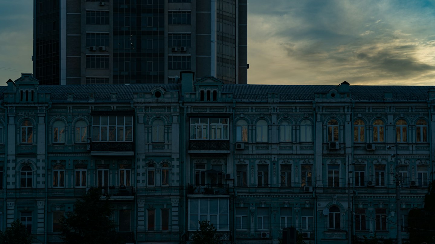 a very tall building with a clock on it's side